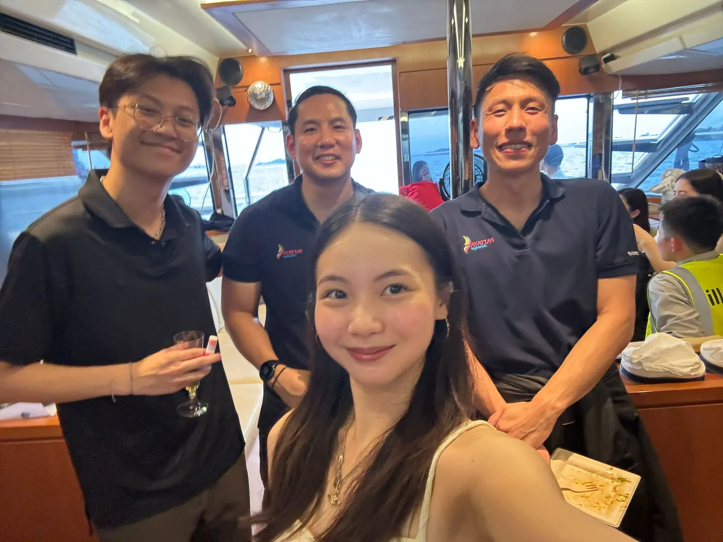 Associates at a team event on a boat in Singapore
